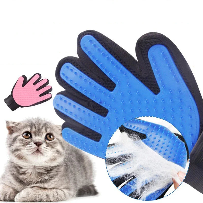 Blue pet grooming glove with black accents, pink inset, and a cat beside it on a white background.