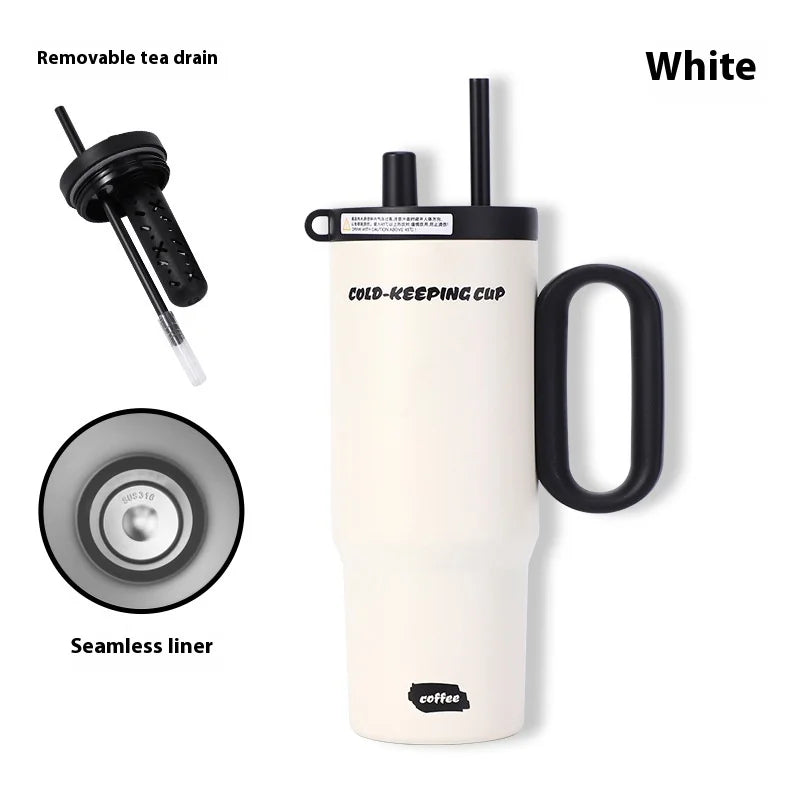 White insulated tumbler with black handle and straw, featuring a removable tea drain and seamless liner on a white background.
