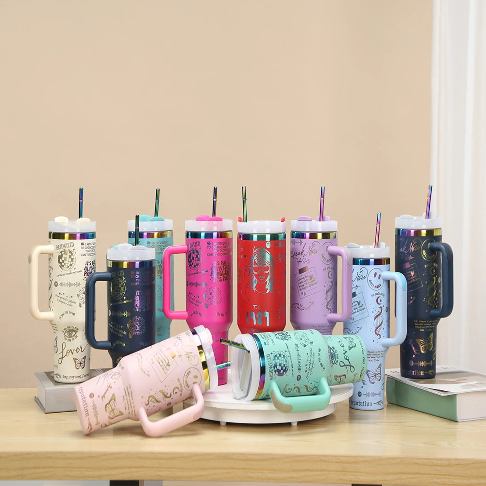 Collection of colorful insulated mugs with handles on a wooden surface.