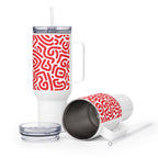 White tumbler with red pattern, straw, and lid on a white background